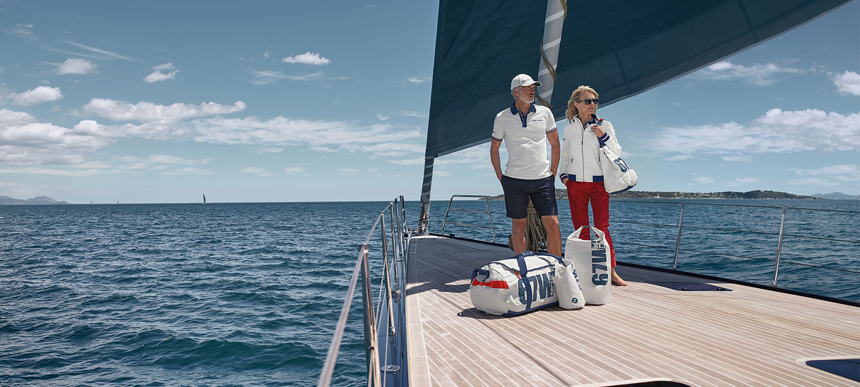 Man en vrouw in BMW Yachtsport kleding. Man en vrouw in BMW Yachtsport kleding.